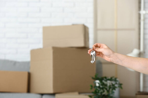 Woman with keys from her new flat, closeup