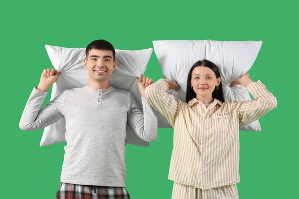Young Couple Pillows Green Background Royalty Free Stock Images
