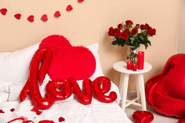 Interior of festive bedroom with different decorations for Valentine\'s Day celebration