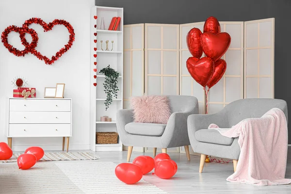 Interior of festive living room decorated with hearts for Valentine\'s Day celebration