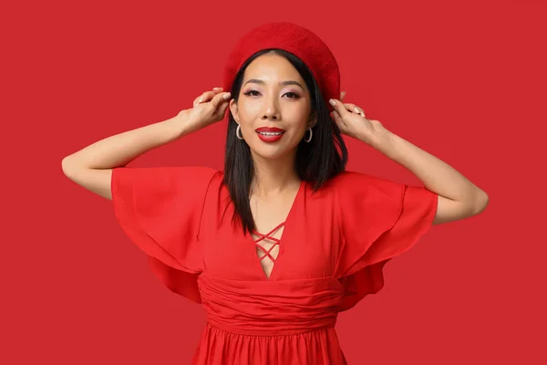 stock image Beautiful Asian woman with stylish makeup on red background