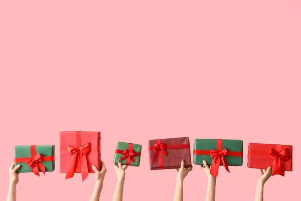 Female Hands Holding Christmas Gift Boxes Pink Background — Stock Photo, Image