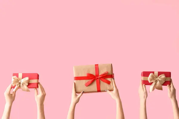 Female Hands Holding Christmas Gift Boxes Pink Background — Stock Photo, Image