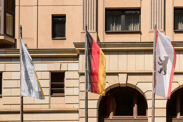 Different flags on city street in Berlin, Germany