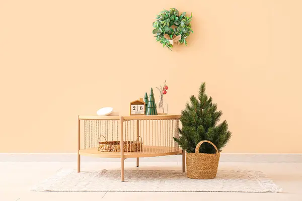 Wooden Coffee Table Christmas Decor Small Fir Tree Beige Wall — Stock Photo, Image