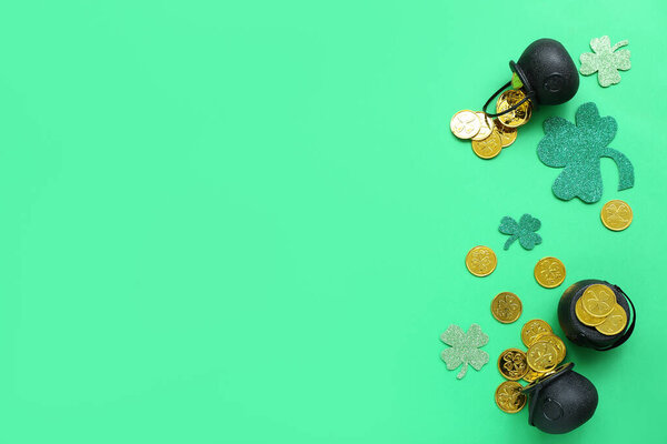 Pots with coins and paper clovers on green background. St. Patrick's Day celebration