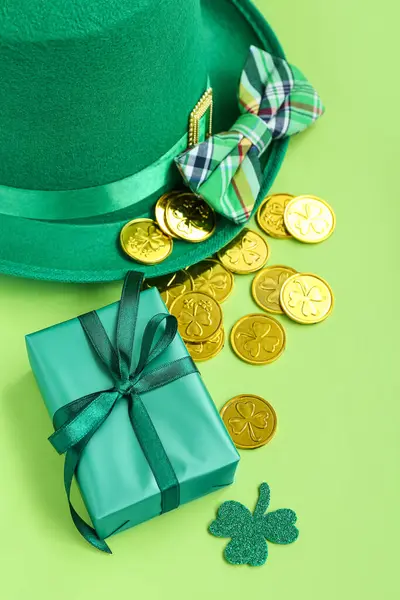 Leprechaun Hat Bow Tie Gift Golden Coins Light Green Background — стоковое фото