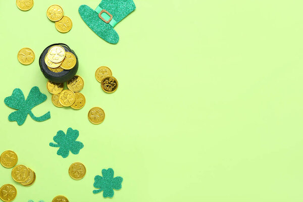 Pot with coins and paper decor on light green background. St. Patrick's Day celebration
