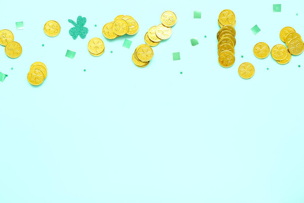 Golden coins with sequins on blue background. St. Patrick's Day celebration