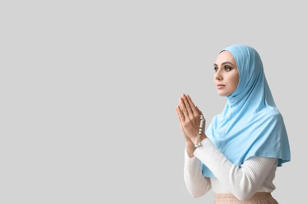 Young Muslim Woman Praying Light Background Islamic New Year Celebration — Stockfoto