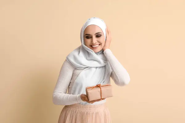 Young Muslim Woman Gift Beige Background Islamic New Year Celebration —  Fotos de Stock