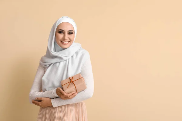 Young Muslim Woman Gift Beige Background Islamic New Year Celebration —  Fotos de Stock