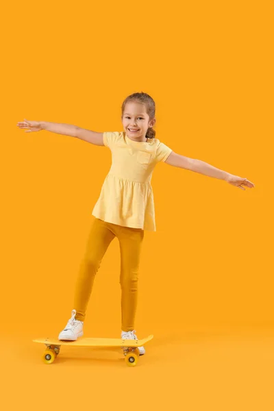 Cute Little Girl Skateboard Yellow Background — Photo