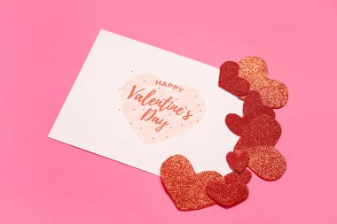 Card with text HAPPY VALENTINE'S DAY and hearts on pink background