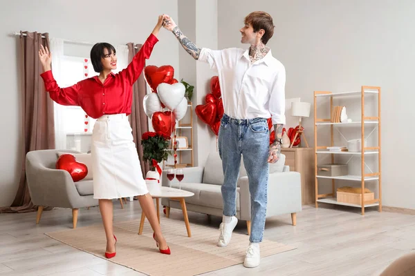 Young couple dancing at home on Valentine\'s Day