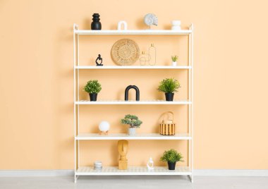 Modern shelf unit near beige wall