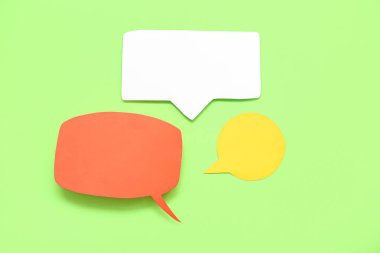 Blank speech bubbles on green background