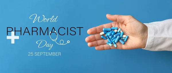 Banner for World Pharmacist Day with hand holding pills