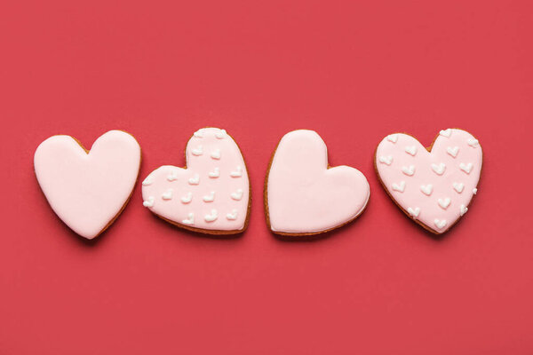 Heart shaped sweet cookies on red background. Valentine's day celebration