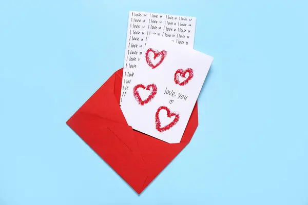 Red envelope with greeting cards on color background. Valentine\'s Day celebration