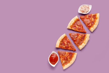 Composition with slices of delicious pepperoni pizza on lilac background