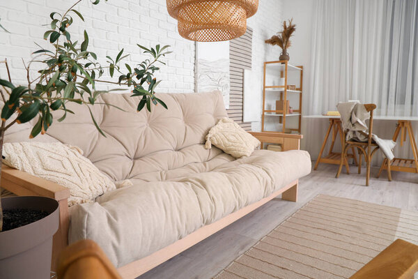 Interior of stylish living room with paintings and sofa