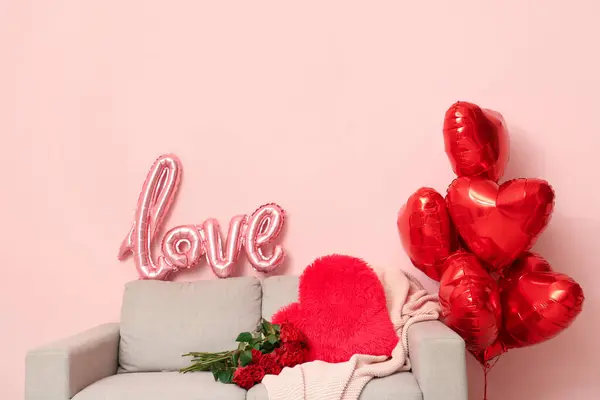 Interior of stylish festive living room with heart-shaped balloons and roses bouquet. Valentine\'s Day celebration