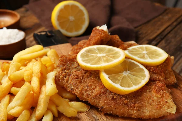 Board Tasty Fried Codfish French Fries Lemon Wooden Background Closeup — Stock Photo, Image