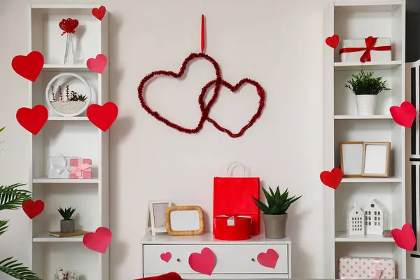Interior of living room decorated with hearts for Valentine's Day celebration