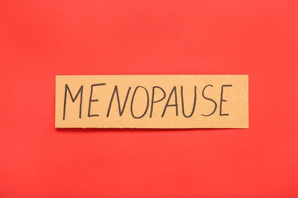 stock image Word MENOPAUSE on red background