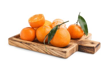 Wooden board with sweet tangerines and leaves on white background