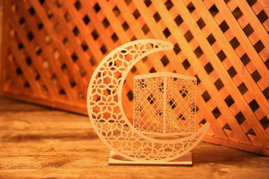 Decorative crescent for Ramadan on wooden table, closeup clipart