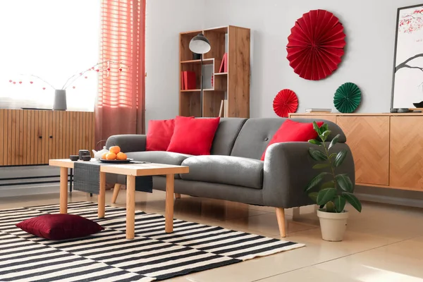 Interior of festive living room with cozy sofa and decor for Chinese New Year celebration