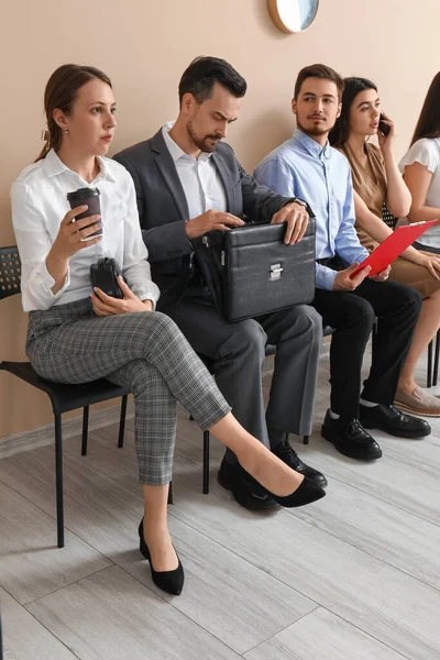 Young people waiting for job interview in room