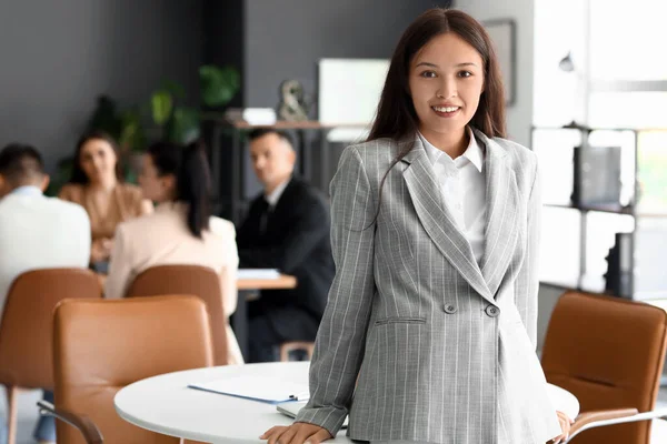 Portrait of Asian businesswoman in conference hall