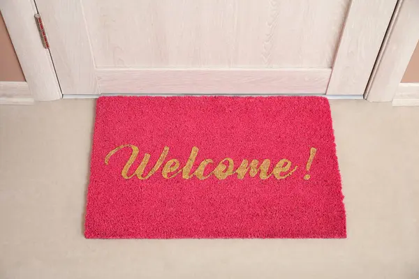 Doormat with word WELCOME in hall, top view