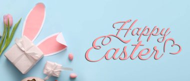 Paskalya bayrağı hediyelerle, yumurtalarla, çiçeklerle ve tavşan kulaklarıyla