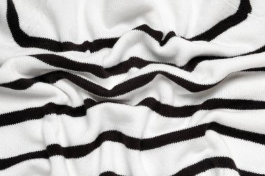 Arka planda kıvrımları olan şık örülmüş kumaş dokusu