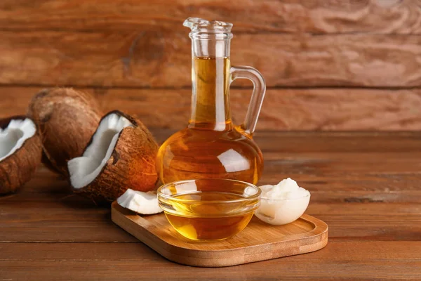 Board Decanter Bowl Coconut Cosmetic Oil Brown Wooden Background — Stock Photo, Image