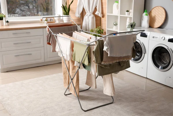 Dryer with clean clothes in laundry room