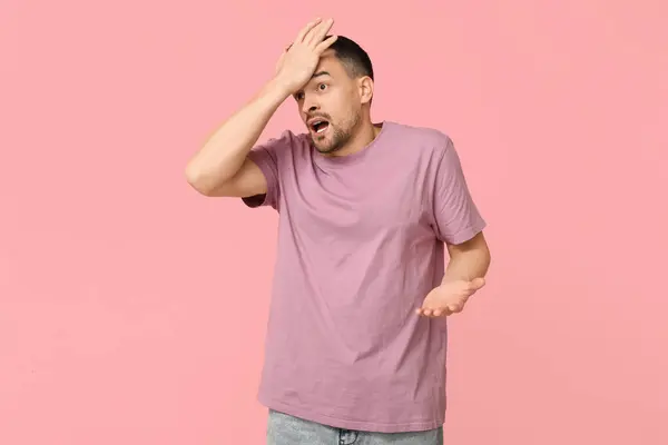 Handsome Worried Young Man Covering Face Hand Pink Background — Stock Photo, Image