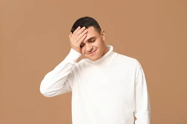 Handsome Ashamed Young Man Covering Face Hand Brown Background — Stock Photo, Image
