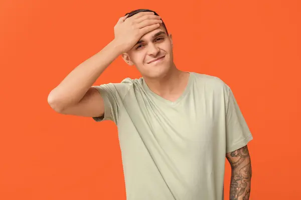 Handsome Ashamed Young Man Covering Face Hand Orange Background — Stock Photo, Image