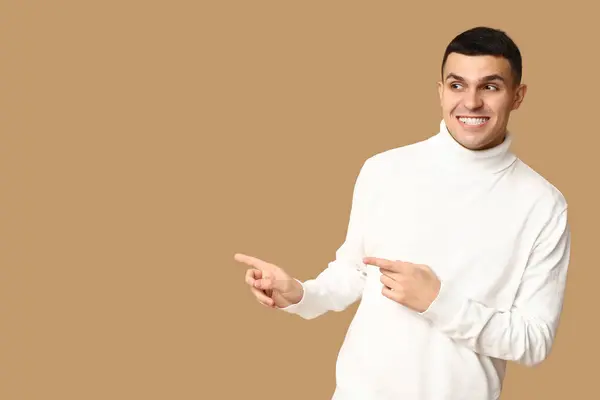 Handsome Ashamed Young Man Pointing Something Brown Background — Stock Photo, Image