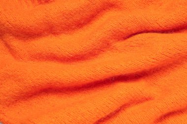 Arka planda kıvrımları olan şık örülmüş kumaş dokusu