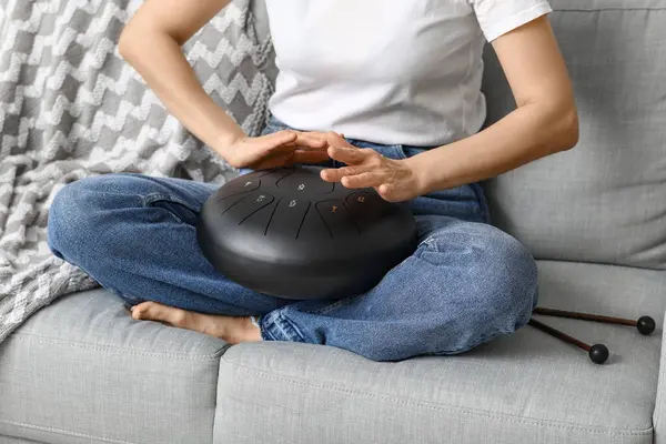 stock image Mature woman with glucophone on sofa at home, closeup