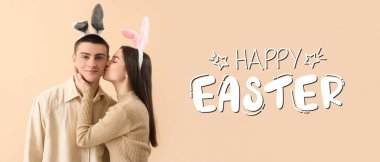 Mutlu genç çiftin tavşan kulağı taktığı Paskalya bayrağı