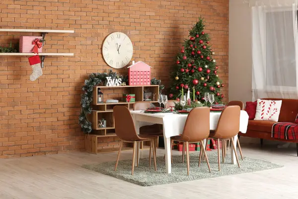 Interior of festive dining room with table served for Christmas celebration