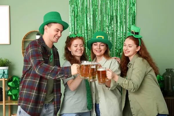 Group of people with beer at home on St. Patrick\'s Day