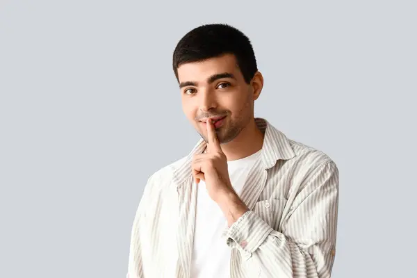 Young Man Showing Silence Gesture Light Background — Stock Photo, Image